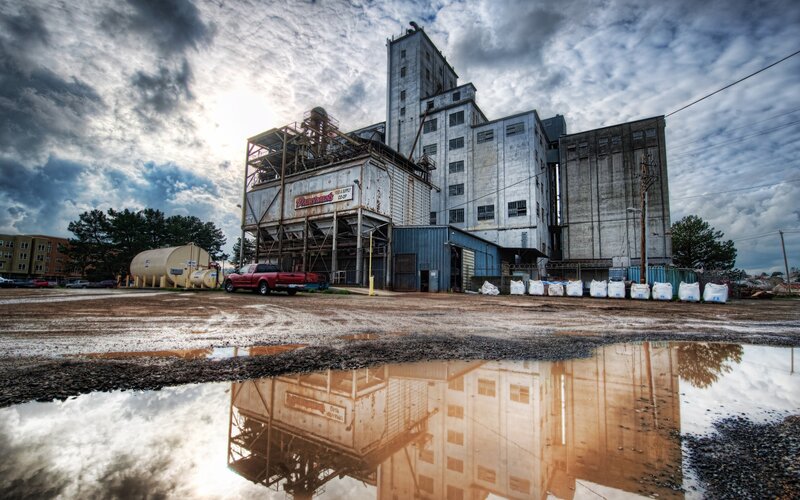 Industrial building with puddle reflection