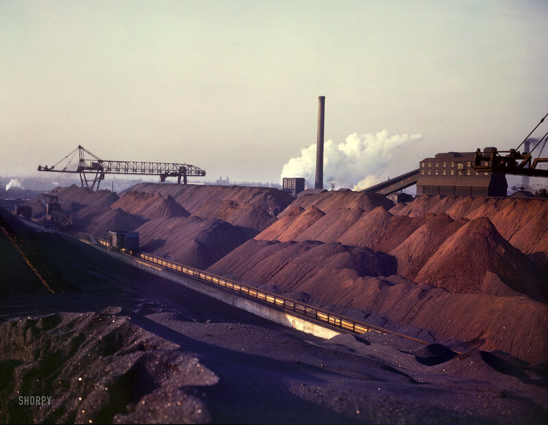Industrial coal yard with smokestack