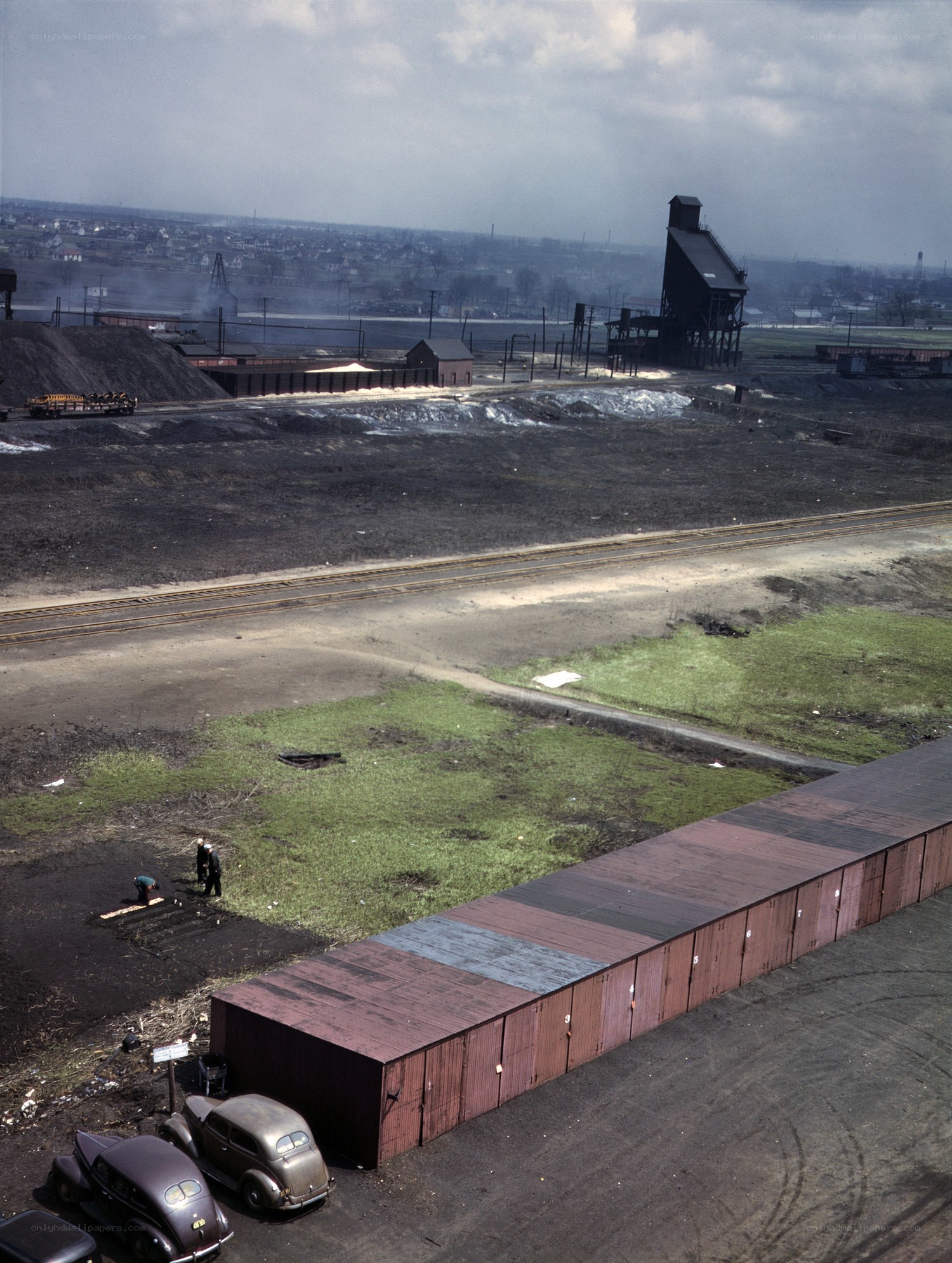 Industrial coal yard with train tracks