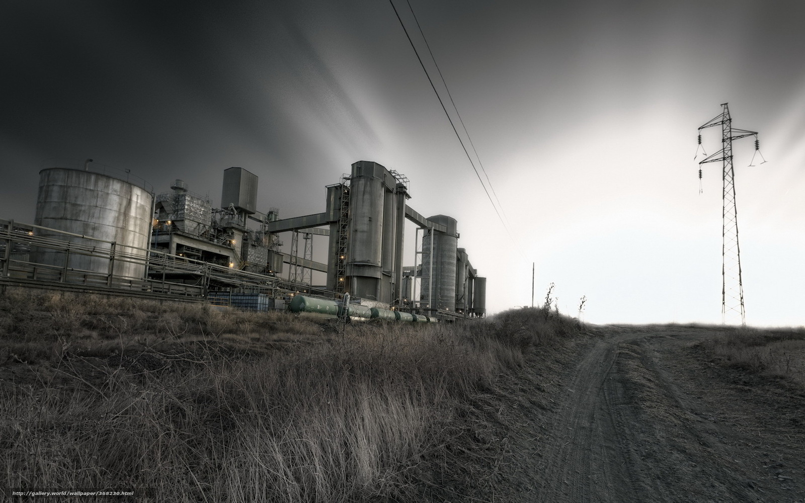 Industrial complex under stormy sky