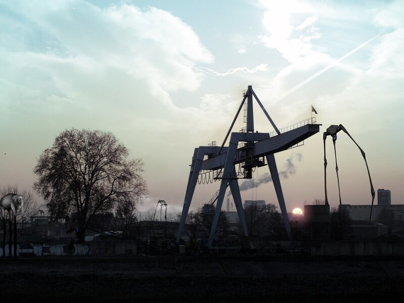 Industrial crane at sunset