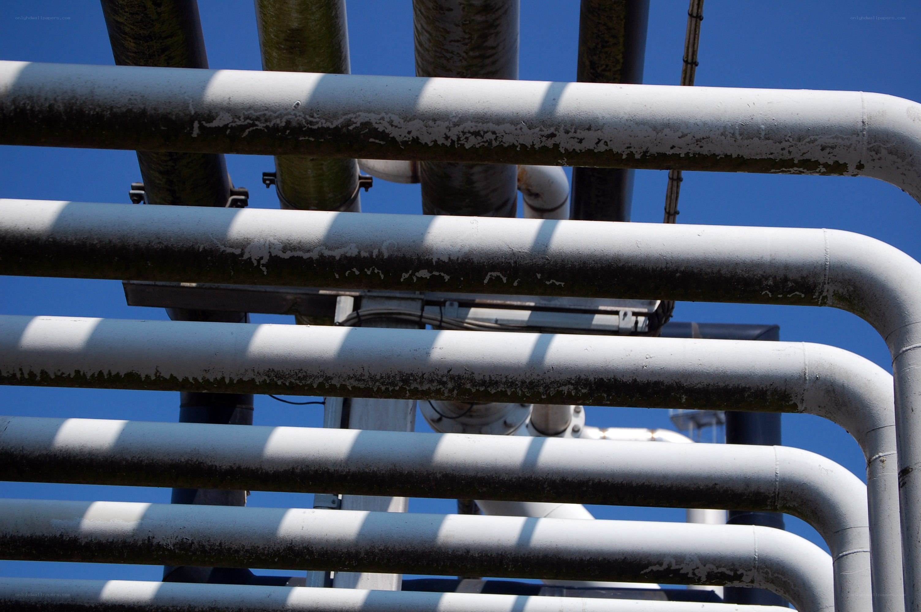 industrial pipes against blue sky