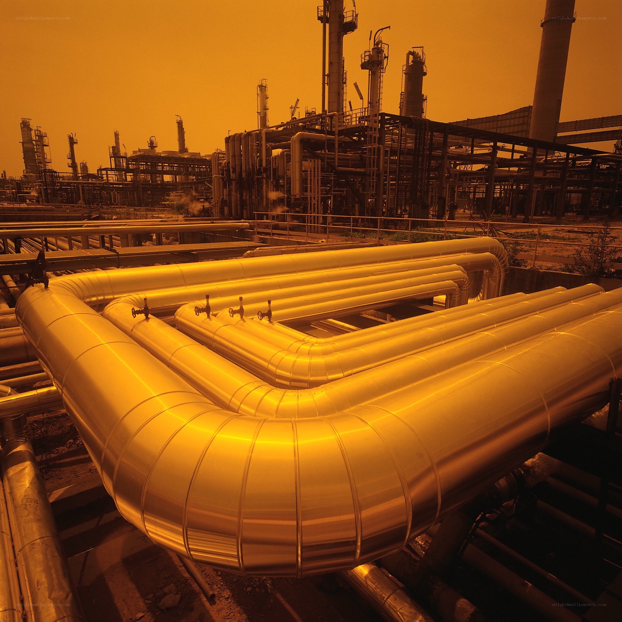 Industrial pipes at sunset