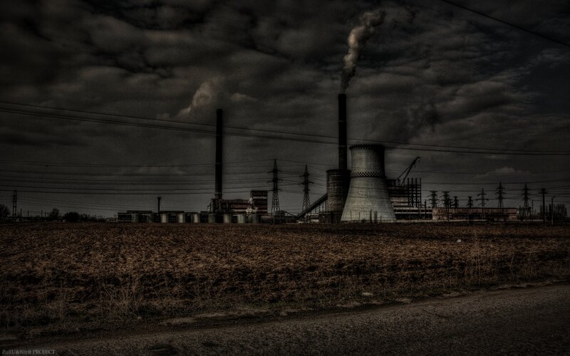 Industrial plant under stormy sky