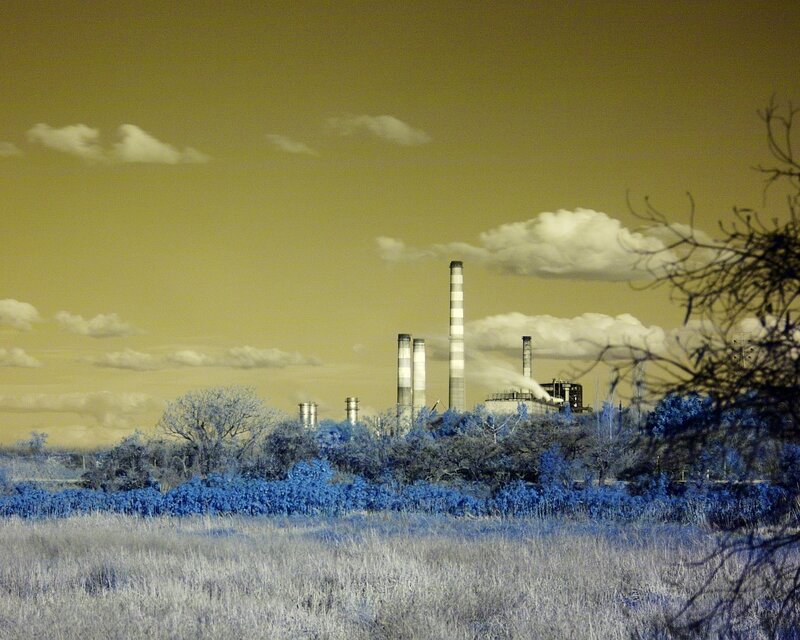 Industrial Plant with Smokestacks — Yellow