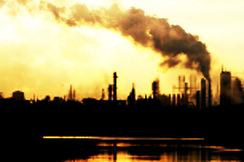 Industrial pollution at sunset