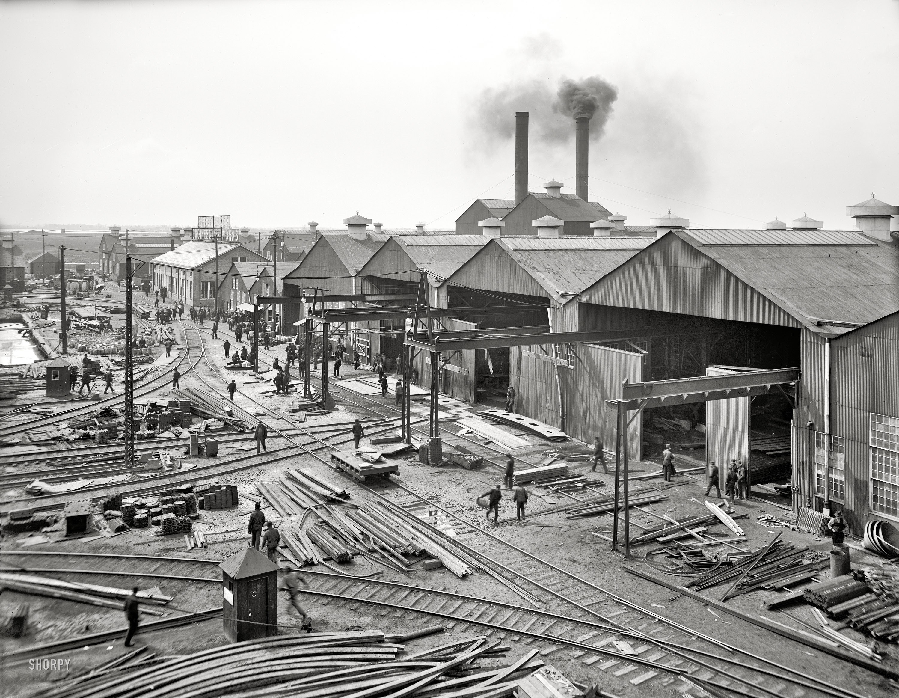 Industrial rail yard with smokestacks