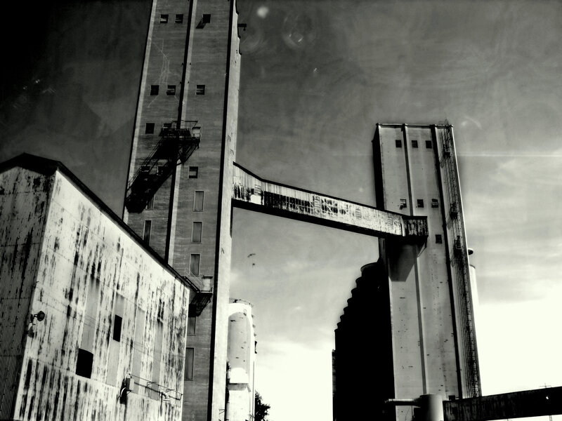 Industrial silos and conveyor bridge