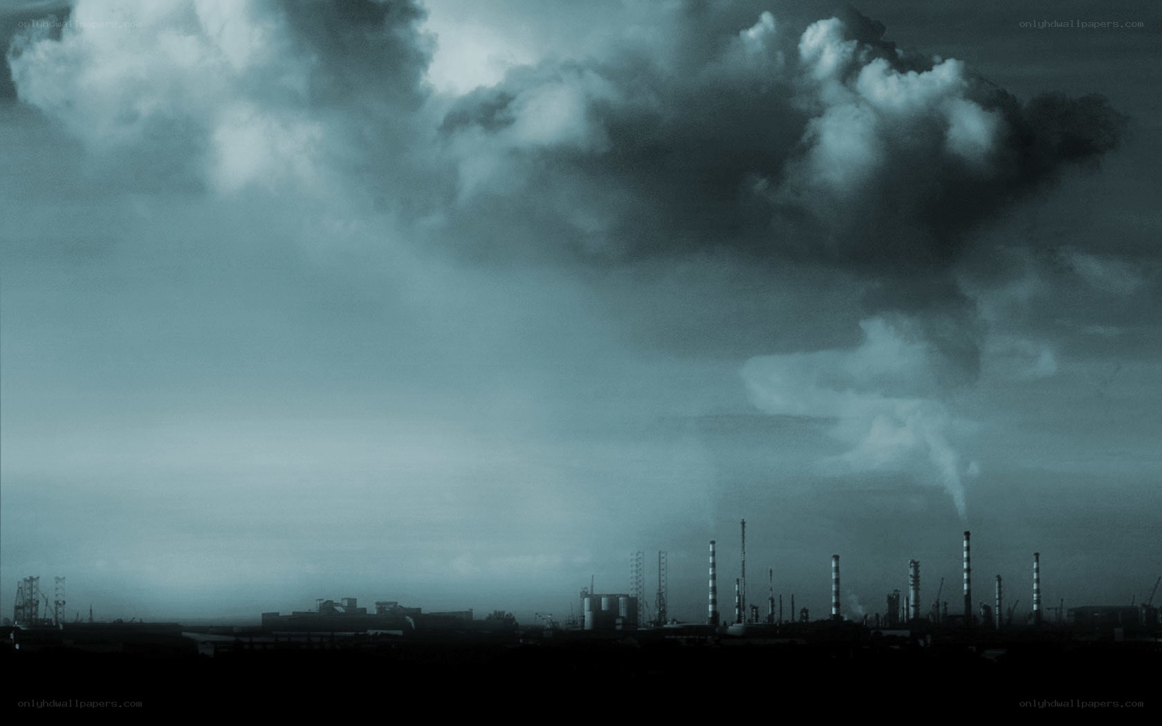 Industrial skyline under stormy sky