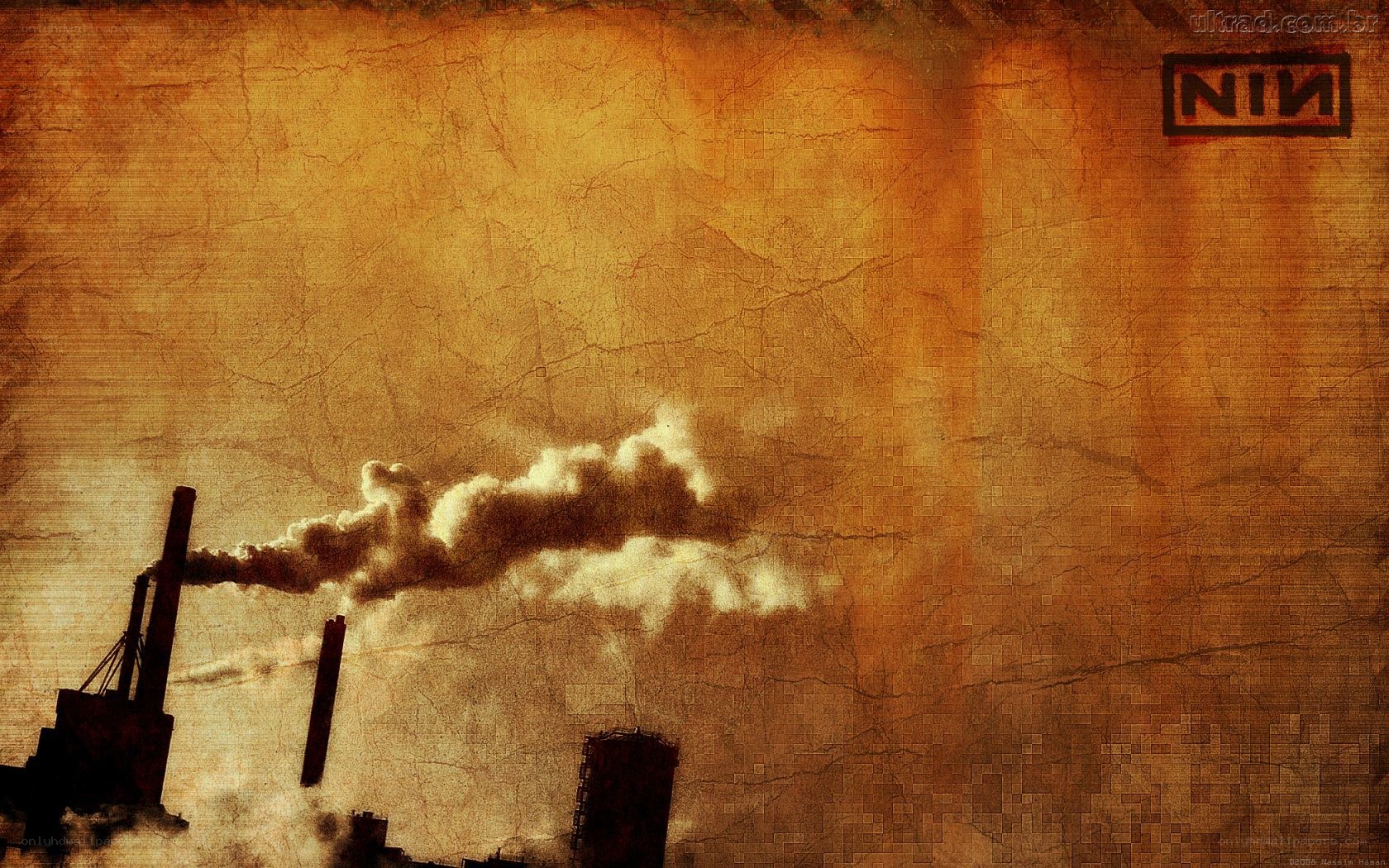 industrial smokestacks at sunset