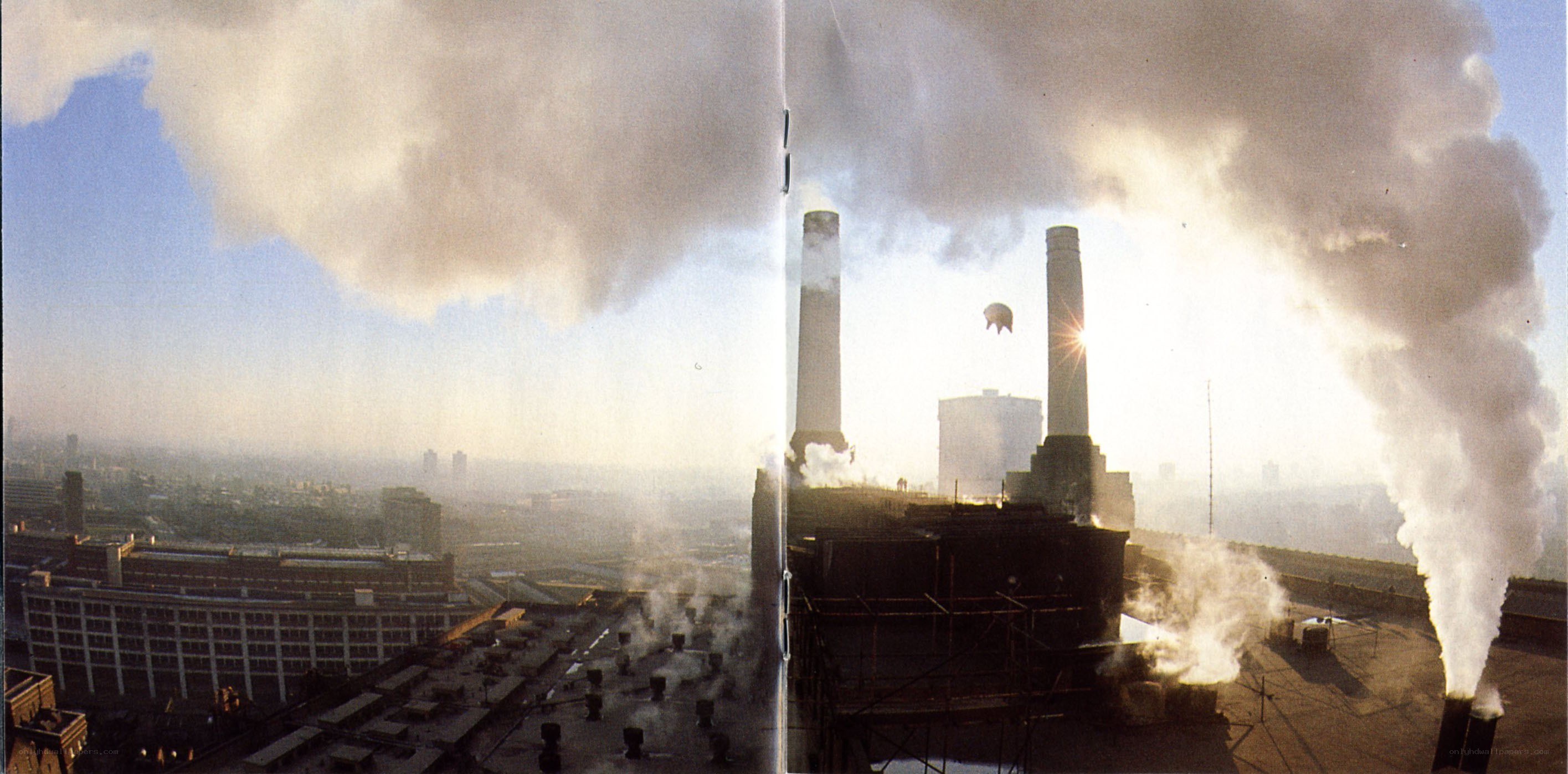 Industrial smokestacks at sunset