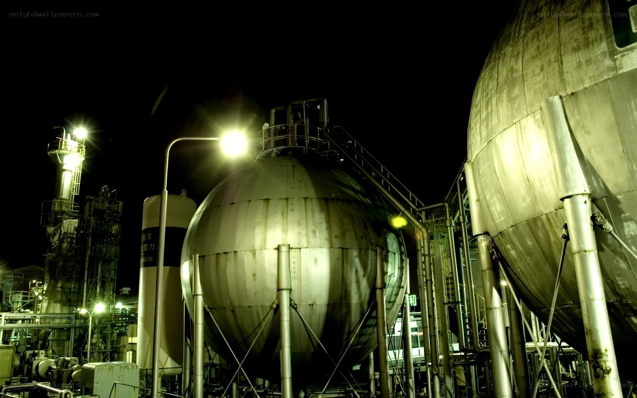 Industrial tanks at night