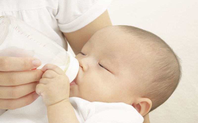 Infant Drinking from Bottle