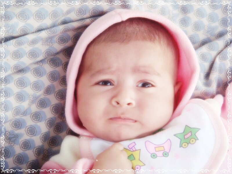 Infant in Pink Hooded Outfit