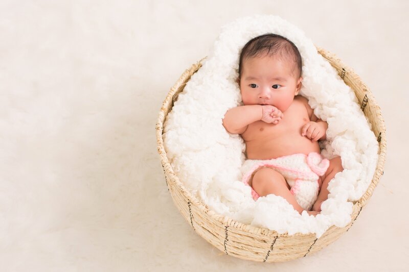 Infant in Woven Basket