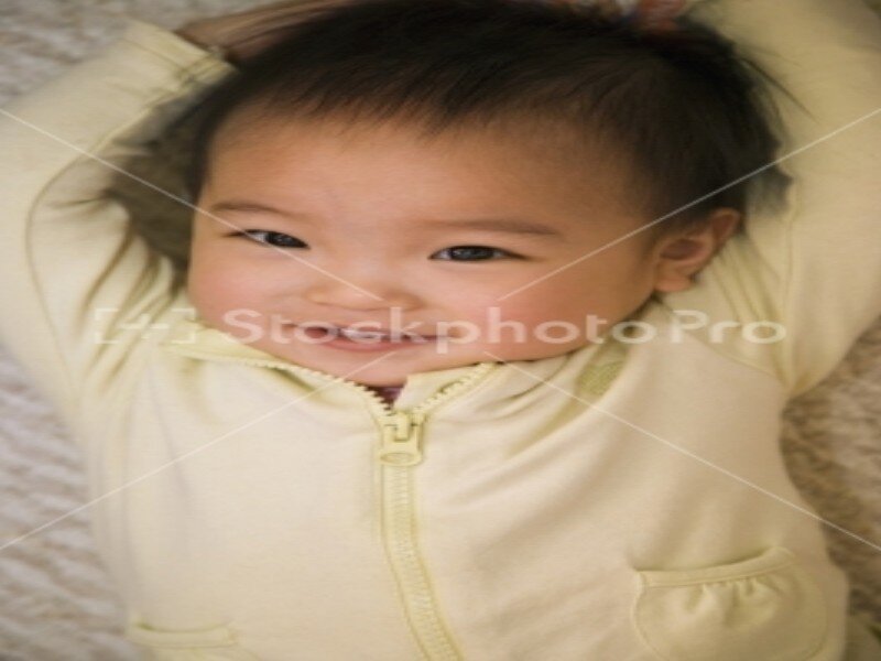 Infant in Yellow Onesie