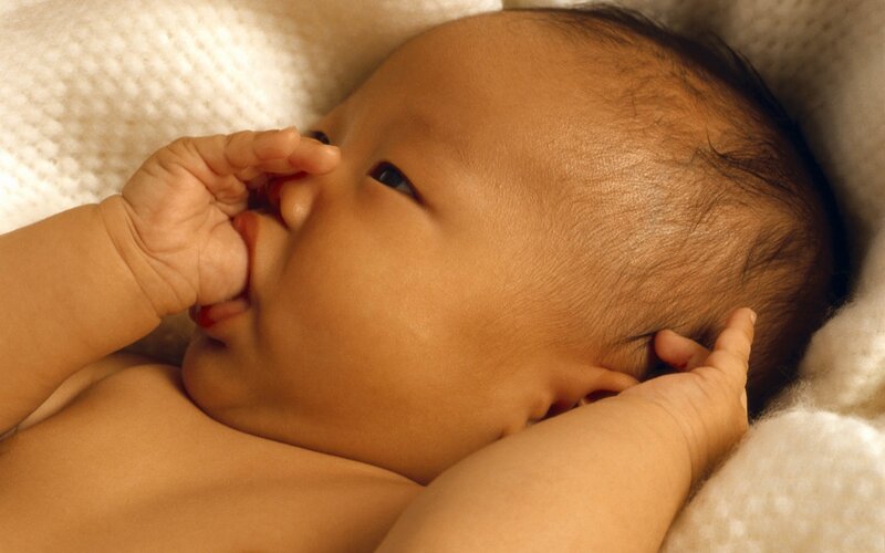 Infant Lying on Blanket — Beige