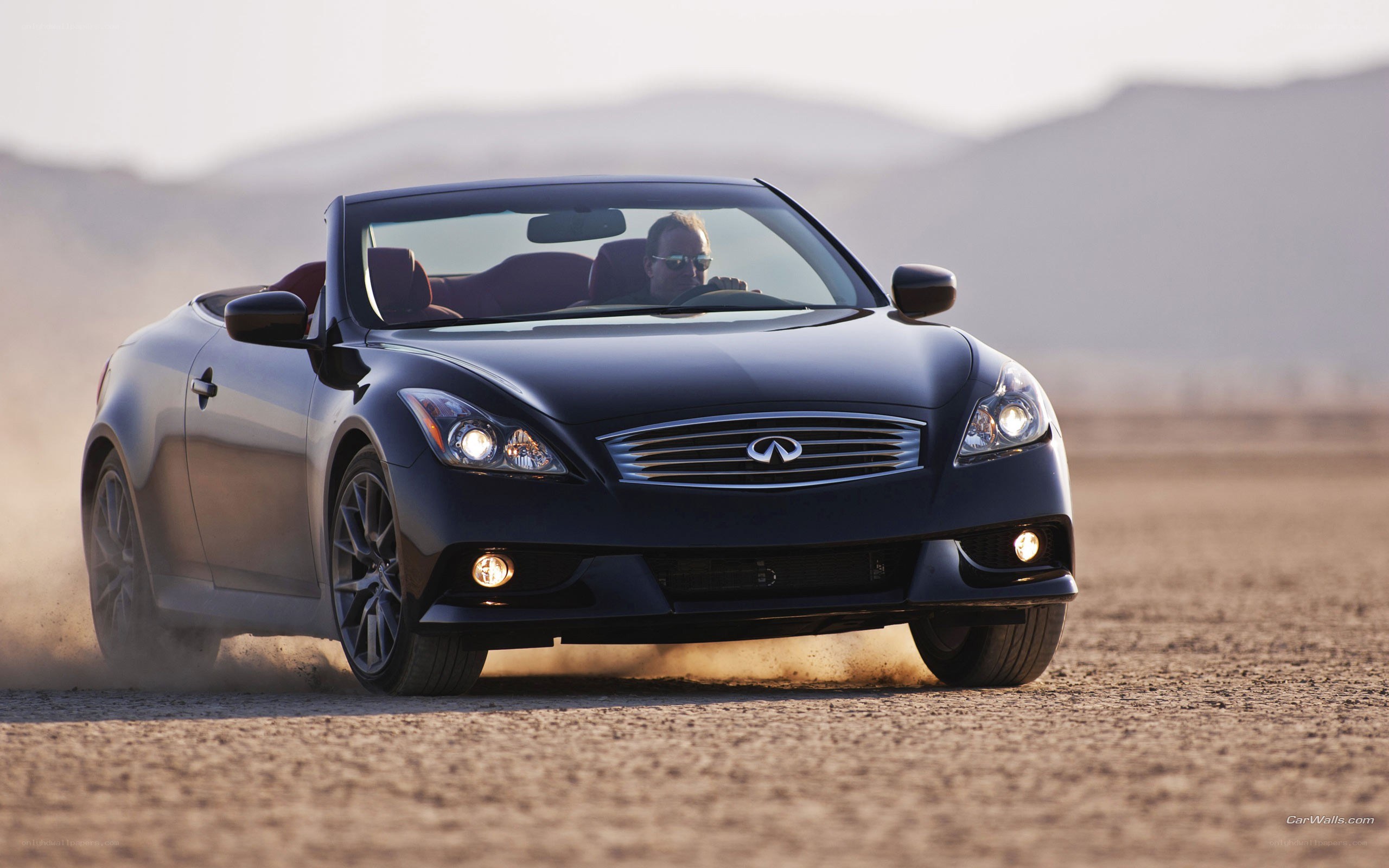 Infiniti convertible driving on dirt