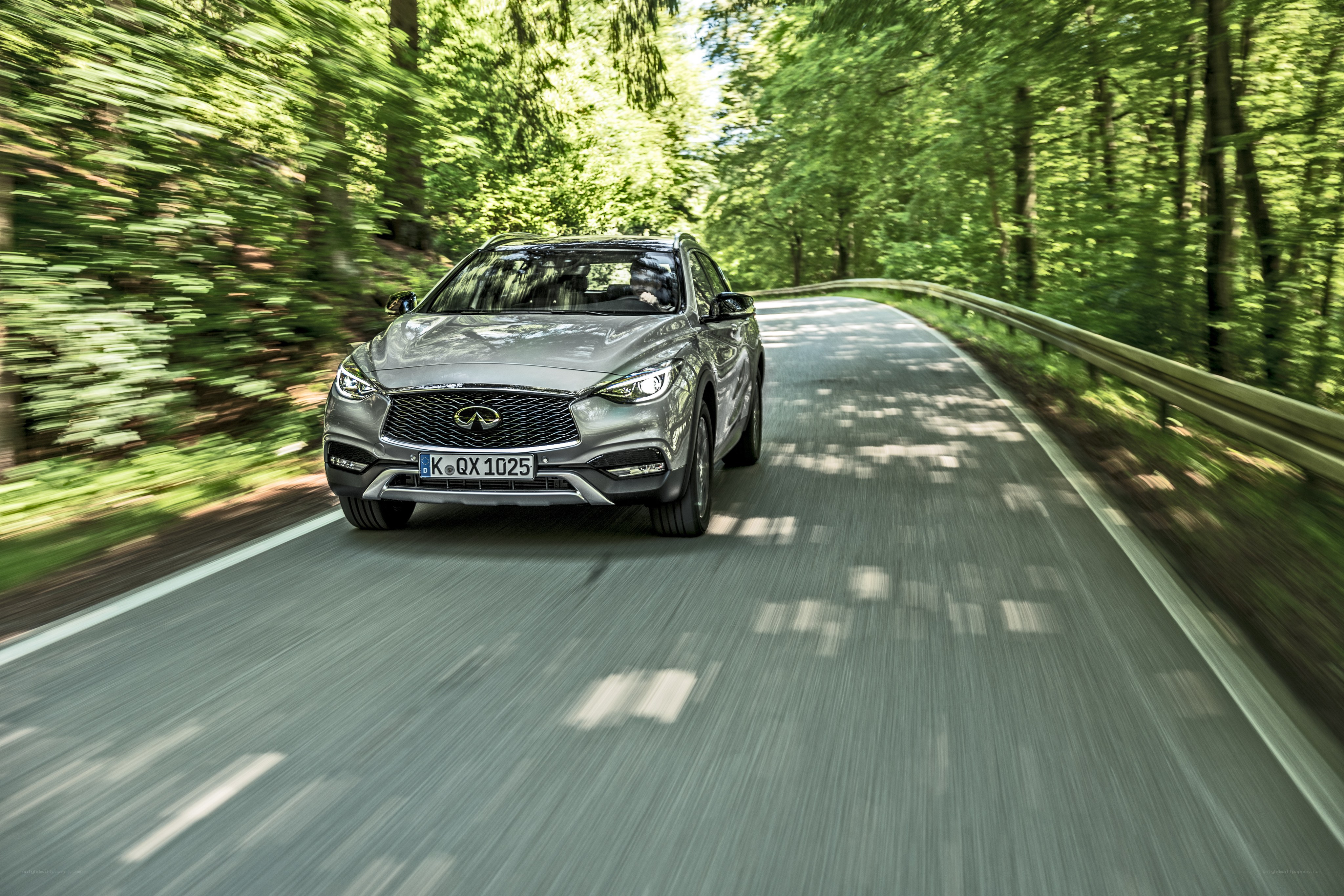 Infiniti QX50 on forest road