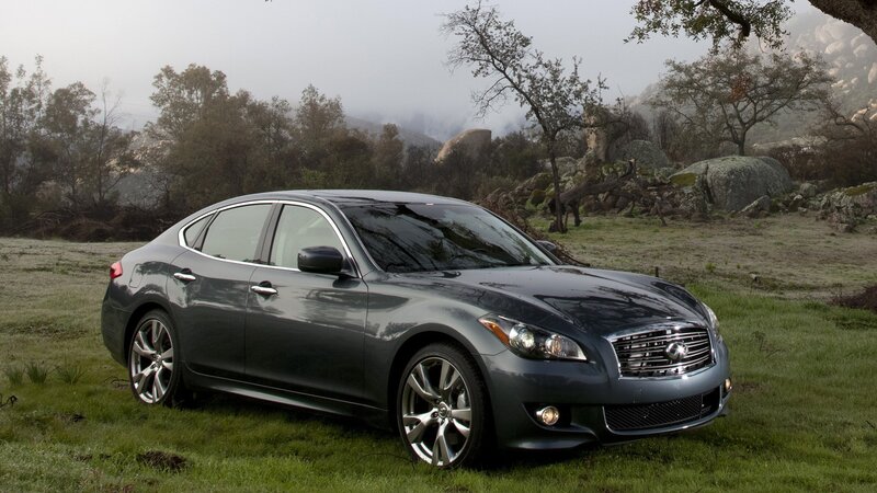 Infiniti sedan in a misty field