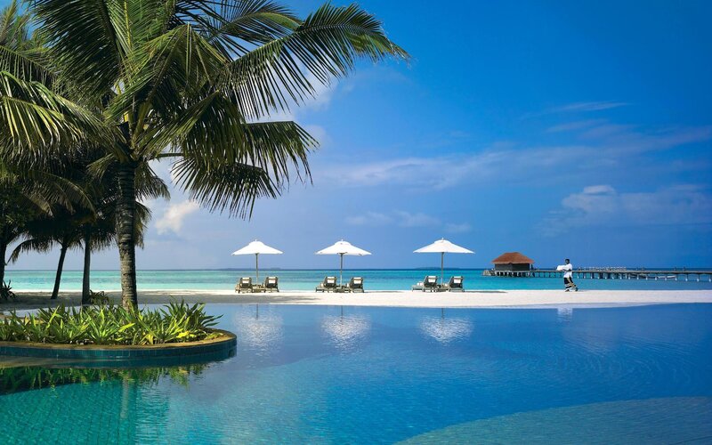 Infinity Pool at Beach Resort — Blue, Serene, Afternoon, Photograph, Palm Trees, Umbrellas