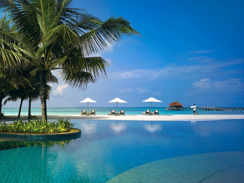 Infinity Pool at Beach Resort — Blue, Serene, Afternoon, Photograph