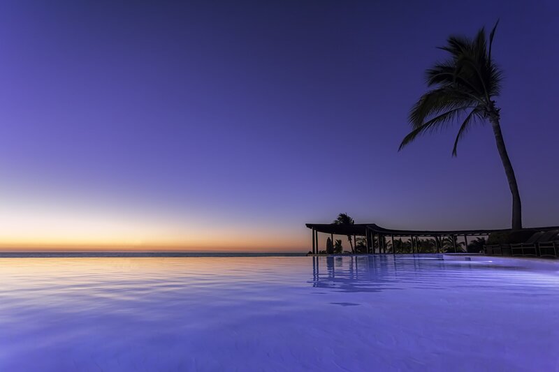 Infinity Pool at Dusk — Blue, Serene, Sunset, Photograph, Palm Tree, Ocean