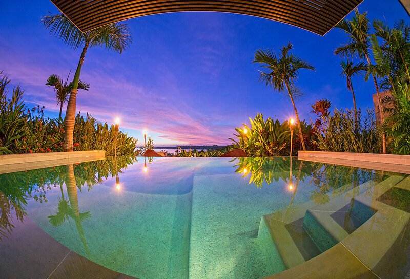 Infinity Pool at Dusk — Blue, Serene, Sunset, Photograph, Palm Trees, Tiki Torches