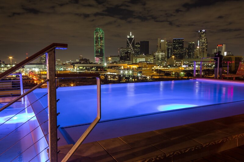 Infinity Pool at Night — Blue, Serene, Photograph, City Skyline, Railing