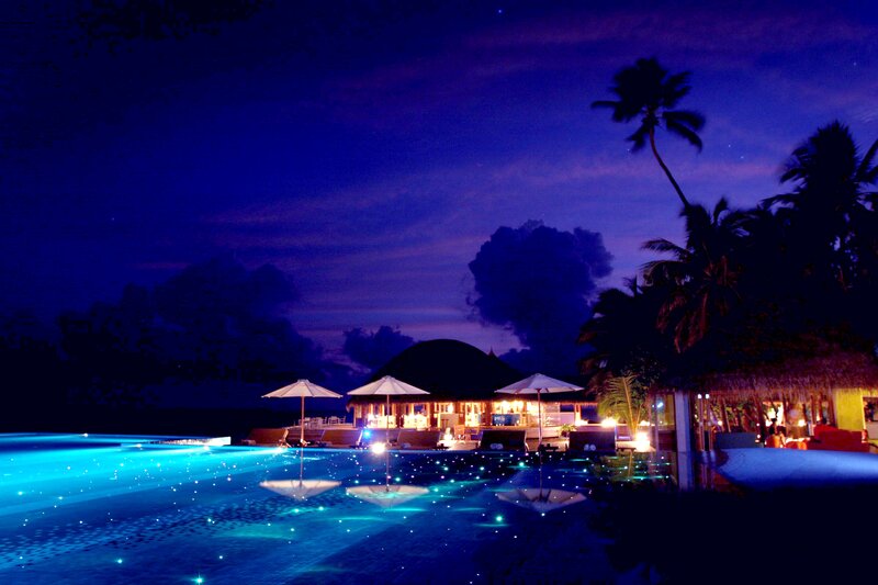 Infinity Pool at Night — Blue, Serene, Photograph, Palm Trees, Umbrellas