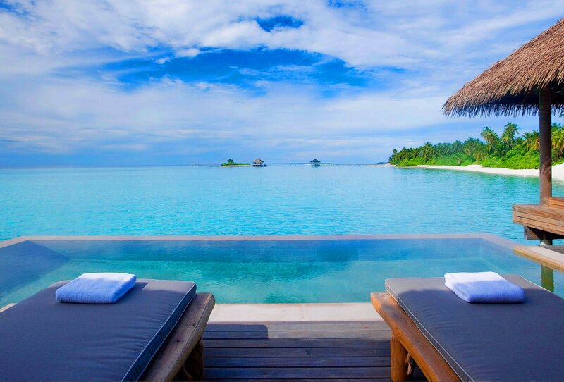 Infinity Pool at Resort — Blue, Serene, Afternoon, Photograph, Lounge Chairs