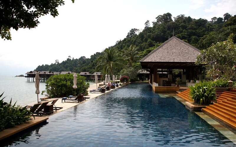 Infinity Pool at Resort — Blue, Serene, Afternoon, Photograph, Palm Trees, Bungalows
