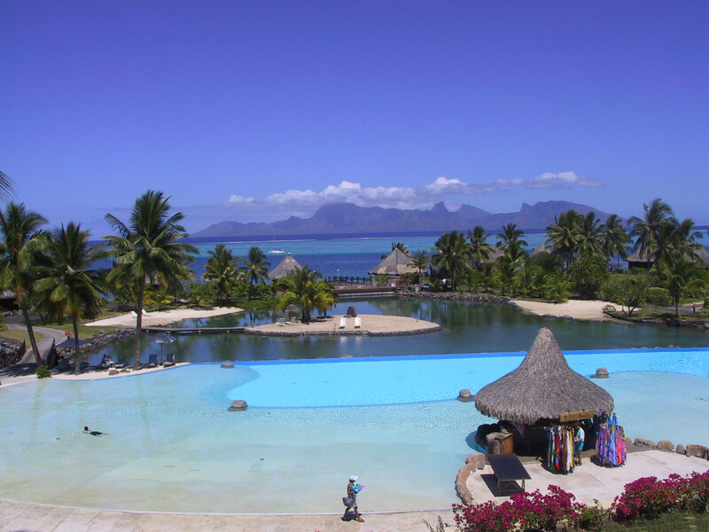 Infinity Pool at Resort — Blue, Serene, Afternoon, Photograph, Palm Trees, Thatched Hut, Mountains
