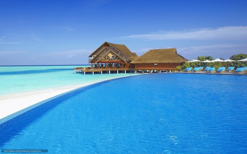 Infinity Pool at Resort — Blue, Serene, Afternoon, Photograph, Thatched Buildings