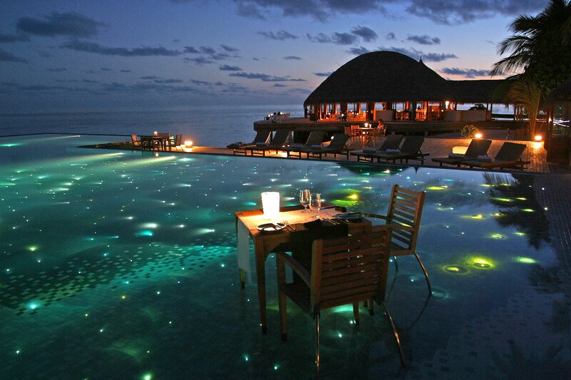 Infinity Pool at Resort — Blue, Serene, Night, Photograph, Table