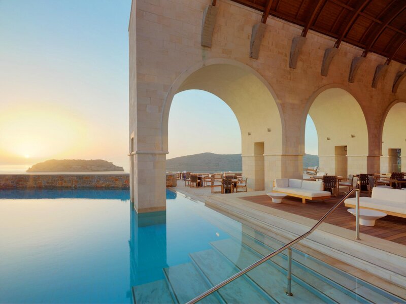Infinity Pool at Resort — Blue, Serene, Sunset, Photograph, Arches