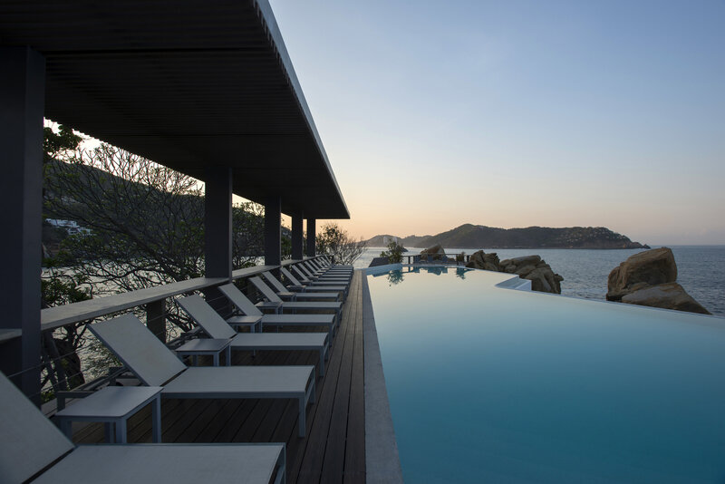 Infinity Pool at Resort — Blue, Serene, Sunset, Photograph, Loungers, Sea