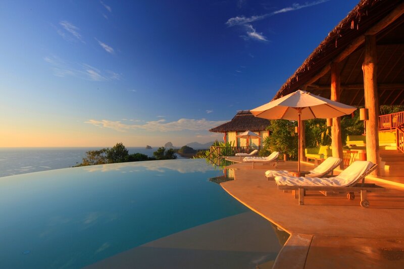 Infinity Pool at Resort — Blue, Serene, Sunset, Photograph, Umbrella