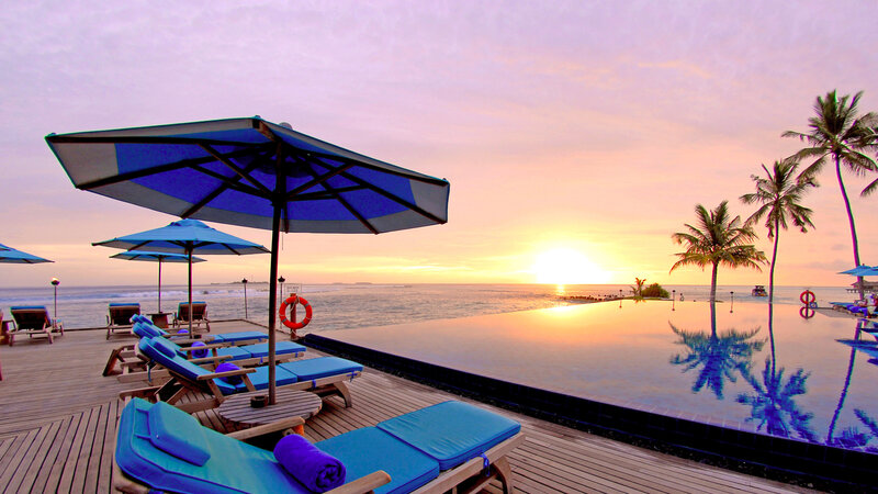 Infinity Pool at Sunset — Blue, Serene, Photograph, Palm Trees, Lounge Chairs, Umbrellas, Ocean