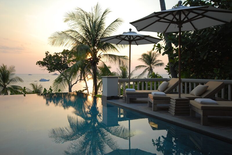 Infinity Pool at Sunset — Blue, Serene, Photograph, Palm Trees, Lounge Chairs, Umbrellas