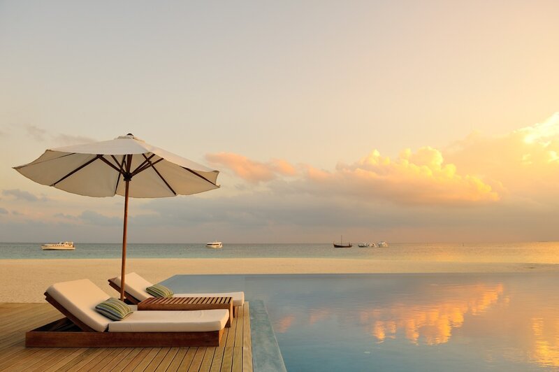 Infinity Pool at Sunset — Blue, Serene, Photograph, Umbrella