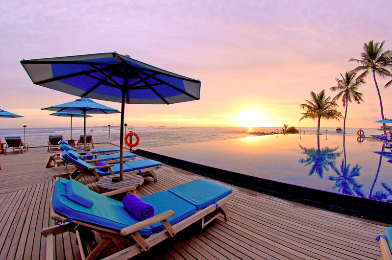 Infinity Pool at Sunset — Blue, Serene, Photograph, Umbrellas, Lounge Chairs