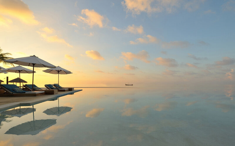 Infinity Pool at Sunset — Blue, Serene, Photograph, Umbrellas