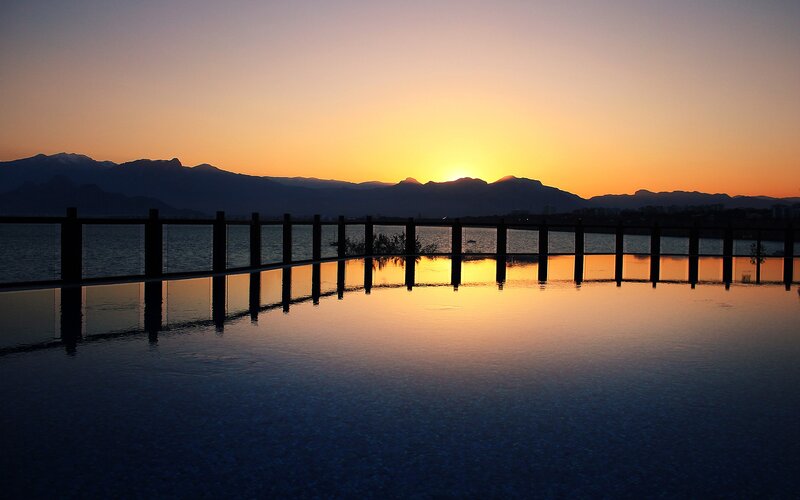 Infinity Pool at Sunset — Orange, Serene, Photograph, Mountains