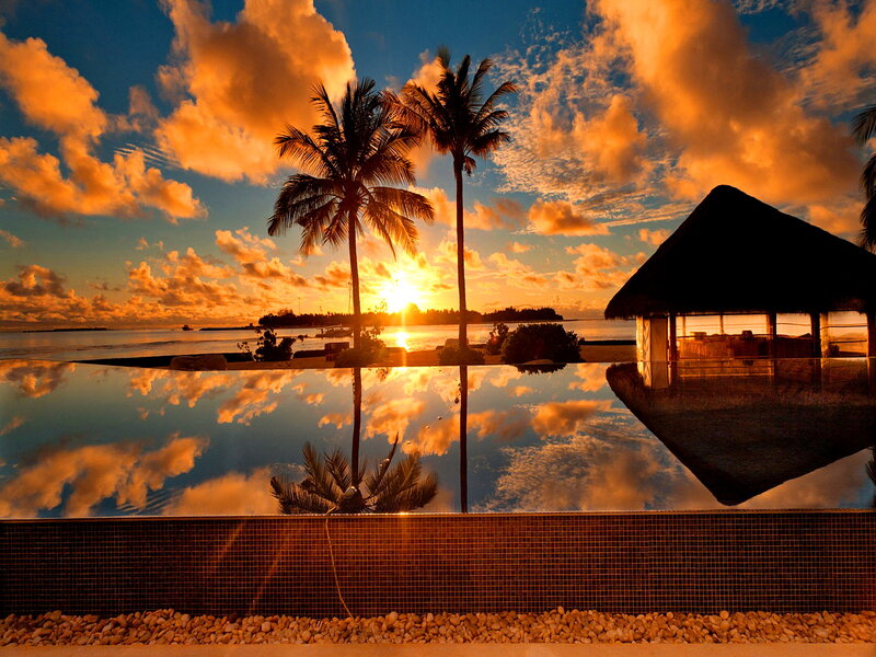 Infinity Pool at Sunset — Orange, Serene, Photograph, Palm Trees, Thatched Hut