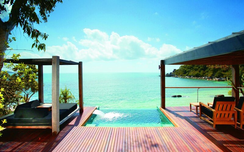 Infinity Pool Overlooking Ocean — Blue, Serene, Afternoon, Photograph, Deck