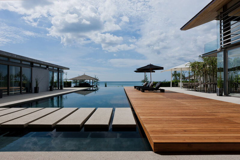 Infinity Pool Overlooking Ocean — Blue, Serene, Afternoon, Photograph, Deck, Umbrella