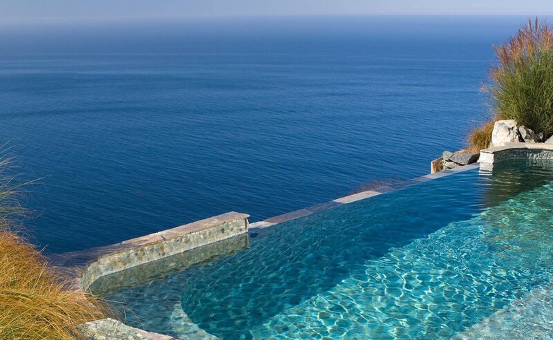 Infinity Pool Overlooking Ocean — Blue, Serene, Afternoon, Photograph, Grass