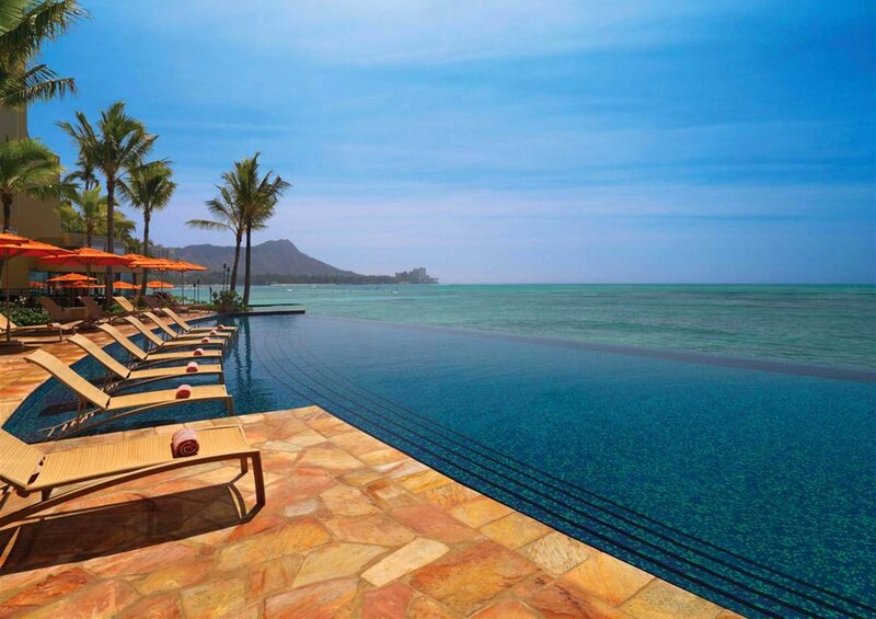 Infinity Pool Overlooking Ocean — Blue, Serene, Afternoon, Photograph, Palm Trees, Lounge Chairs, Mountain