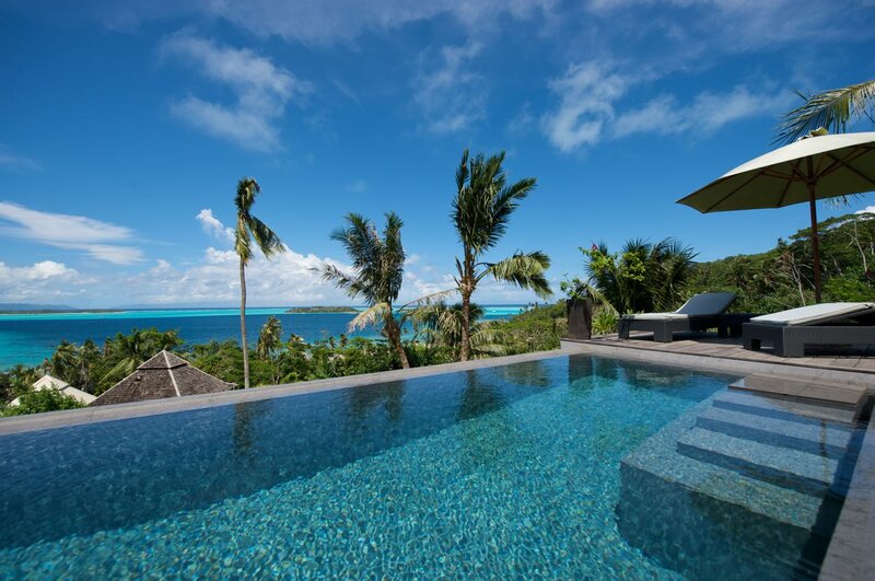 Infinity Pool Overlooking Ocean — Blue, Serene, Afternoon, Photograph, Palm Trees, Lounge Chairs